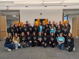 Giving Group team in matching shirts